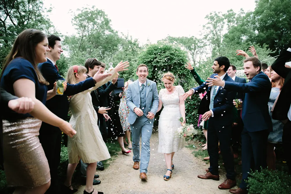 CONFETTI THROWN AT COUPLE AT THE PERCH INN OXFORD - PHOTO BY PHILIPPA JAMES PHOTOGRAPHY