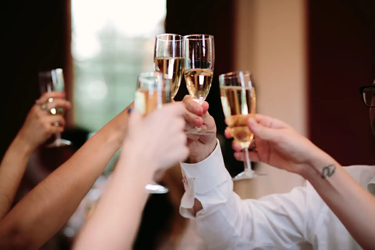 Guests raising glasses of champagne in a toast