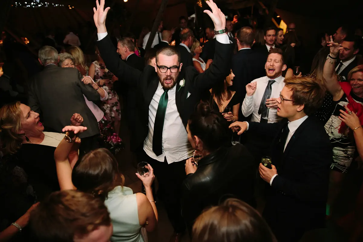 Guests dancing at wedding with DJ