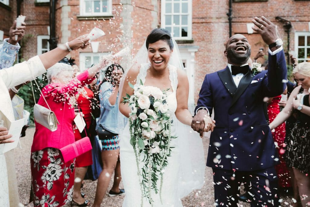 confetti thrown onto couple - captured by wedding photographer