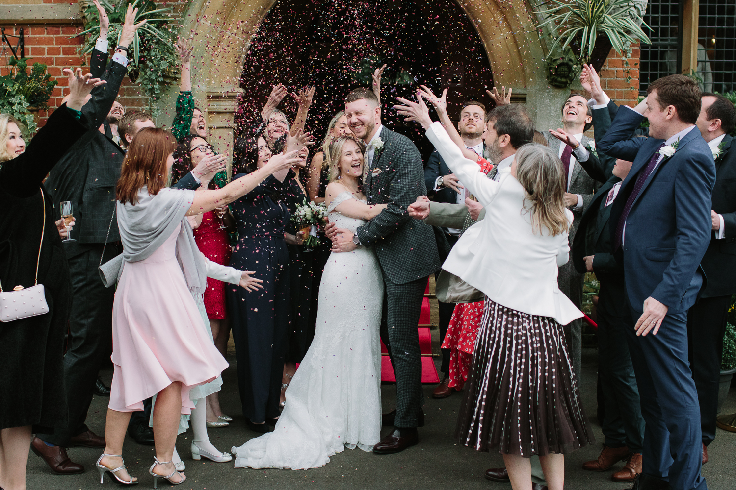 wedding photographer capturing the confetti shot