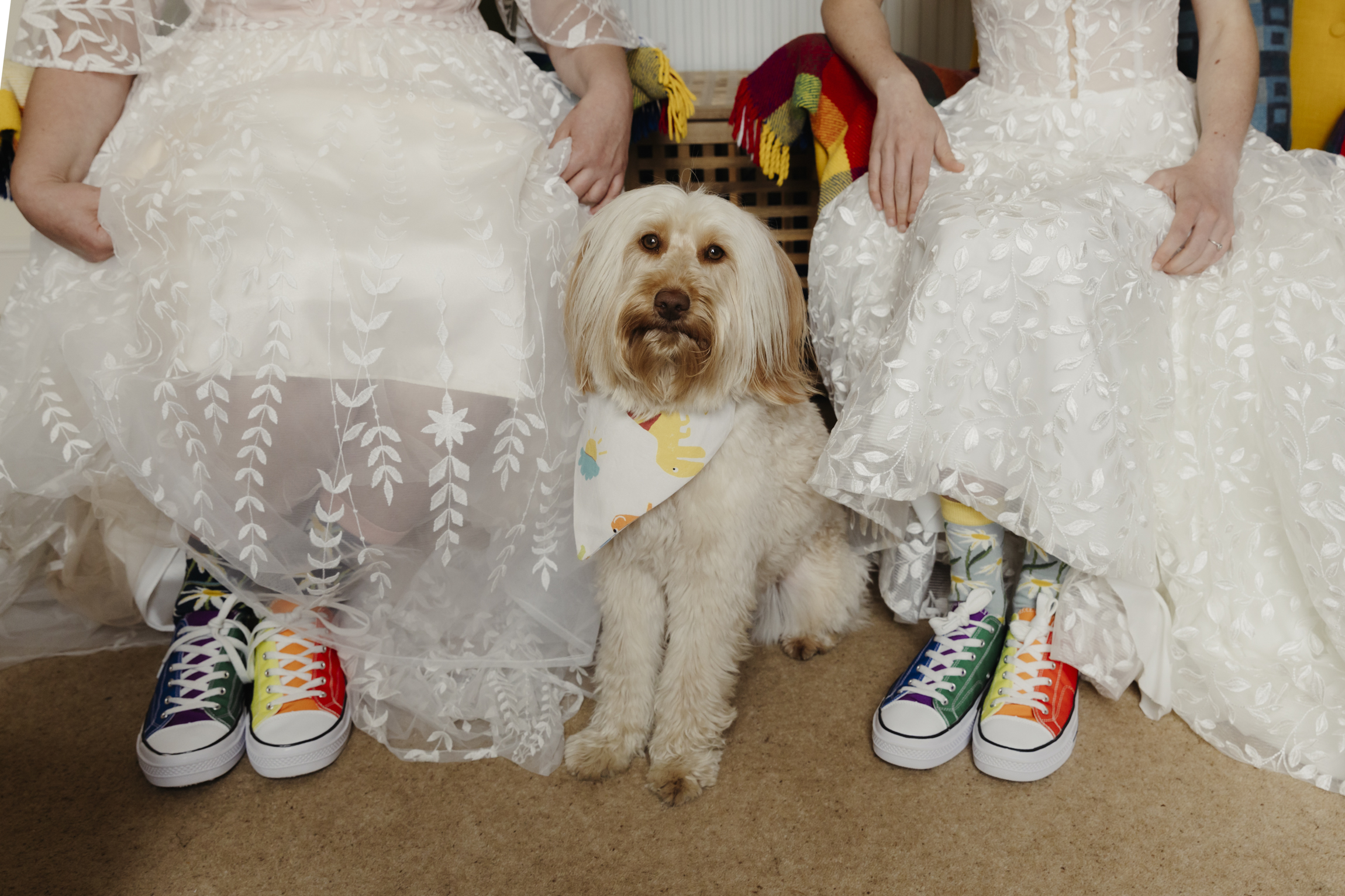 Two brides with their dog, preparing to get married