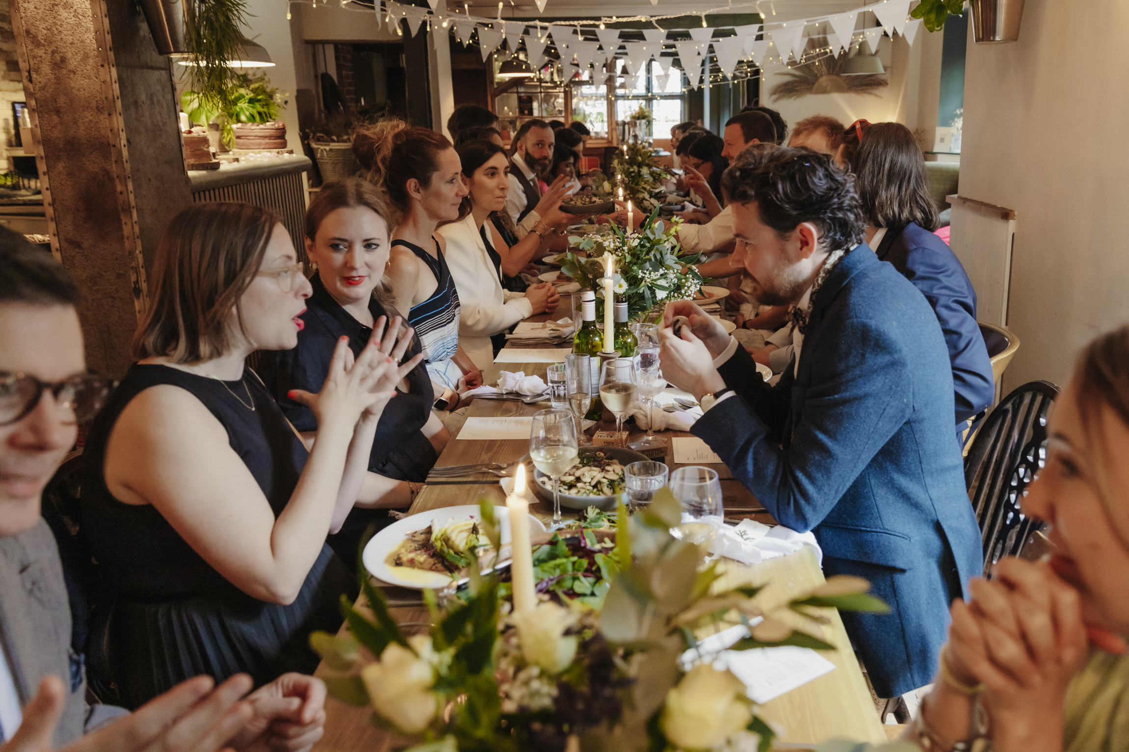 Wedding guests eating  at Oxford Blue pub reception