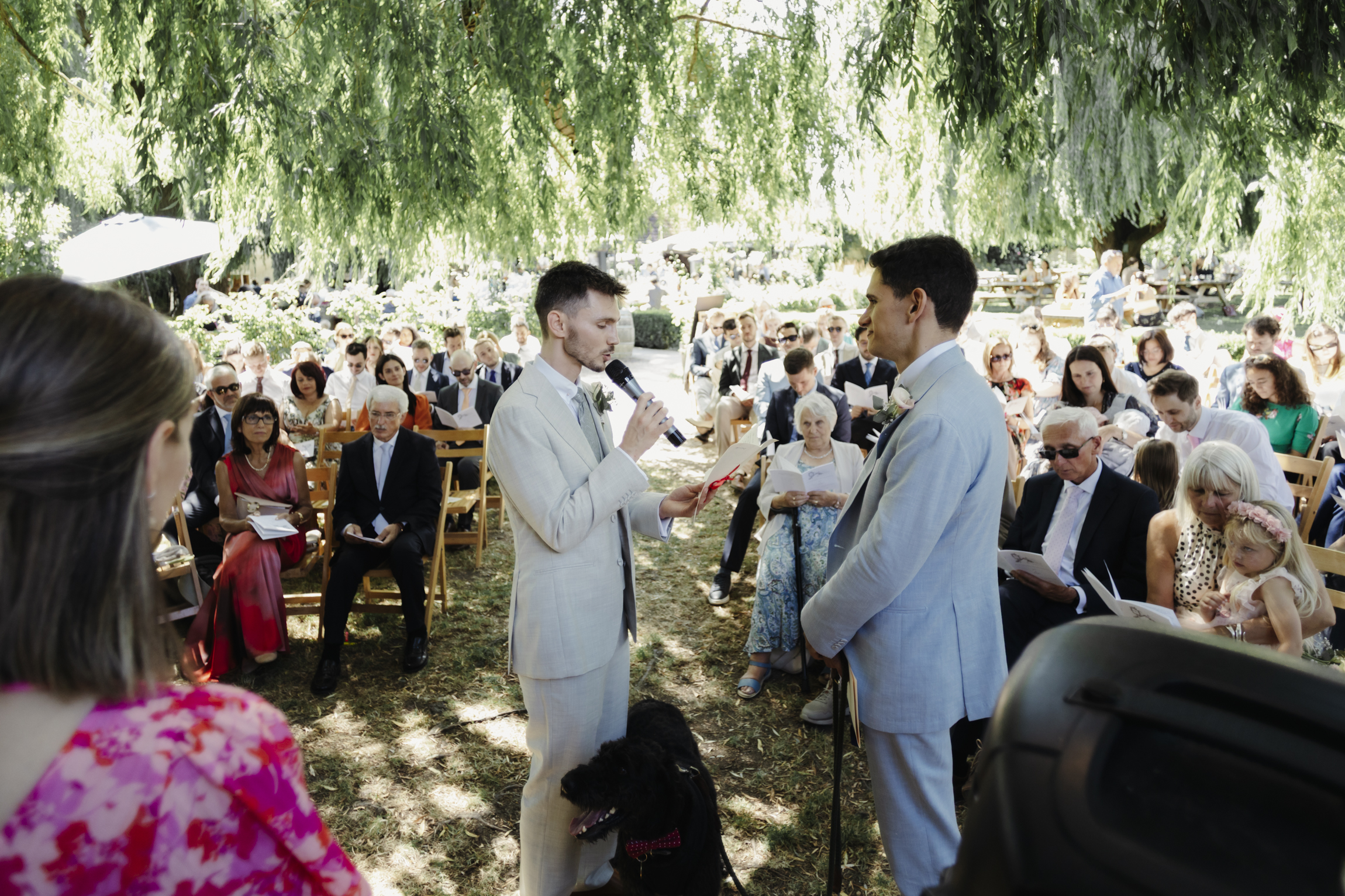 Couple exchanging vows under willow tree The Perch Oxford wedding
