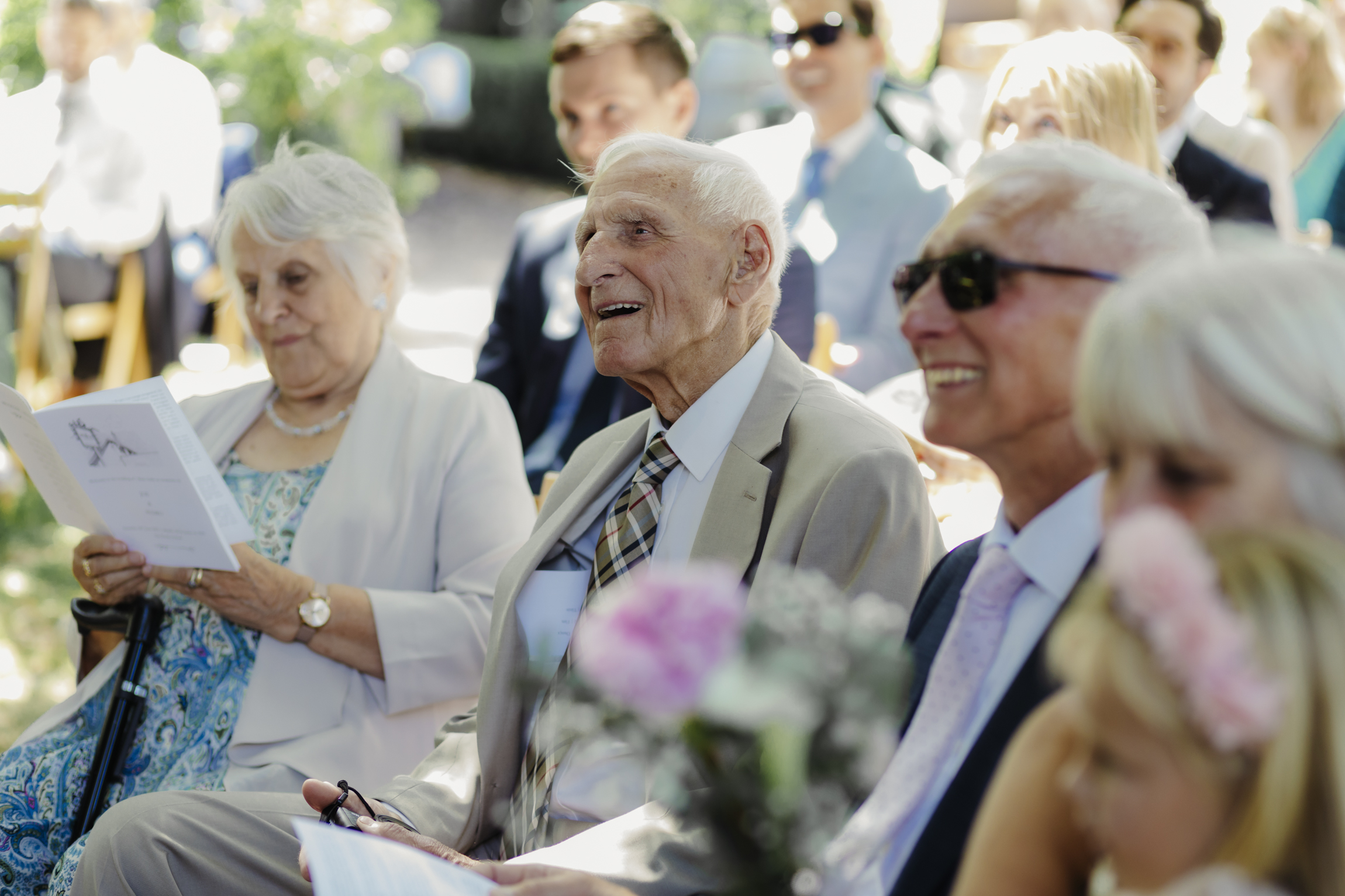 Guests at outdoor wedding ceremony at The Perch wedding venue Oxford
